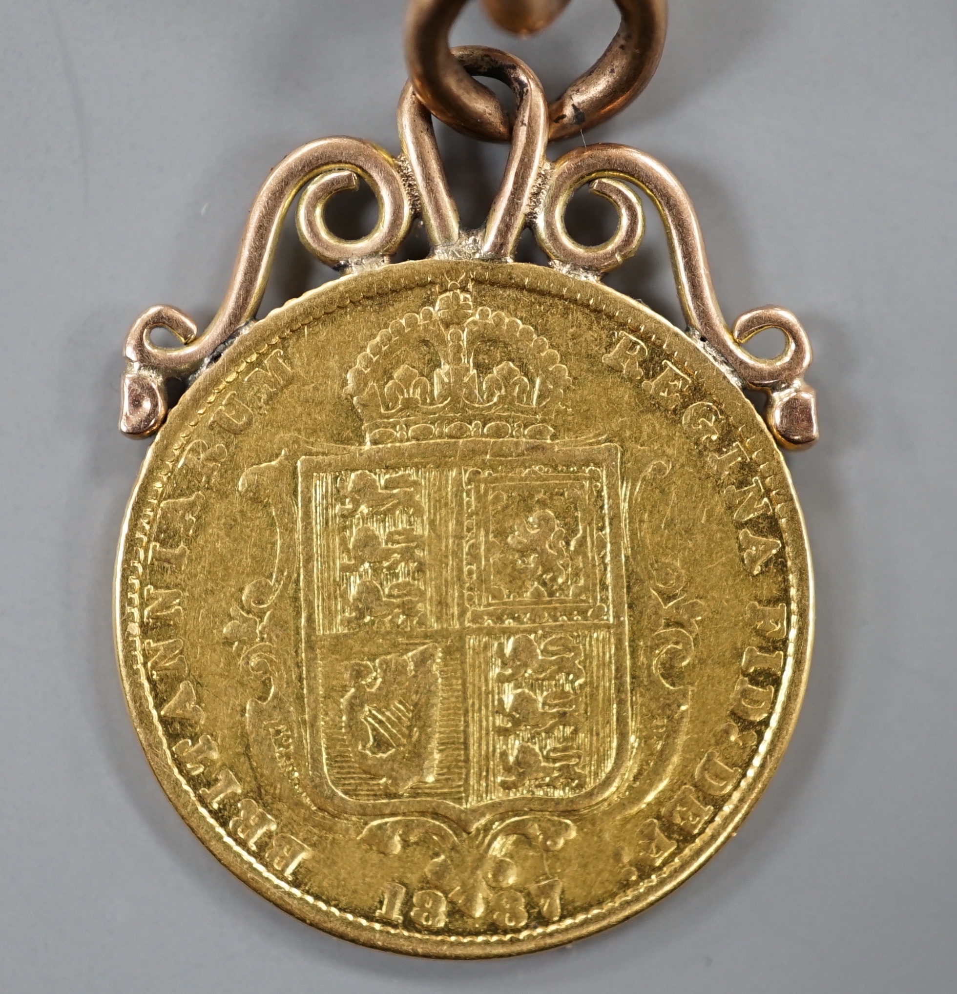 A Victoria 1887 half sovereign, now mounted on a 9ct gold fob with T-bar